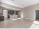 Open-concept living area showcasing the kitchen, complete with tile floors and a spacious layout at 30323 W Sheila Ln, Buckeye, AZ 85396