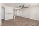 Bright living room with wood-look floors, a fan, and ample space for entertaining friends and Gathering at 3437 E Acoma Dr, Phoenix, AZ 85032