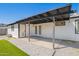Covered patio with paver and artificial turf landscape at 3437 E Acoma Dr, Phoenix, AZ 85032