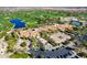 Stunning aerial view of a resort-style community with lush golf course, pools, and tennis courts at 36053 N Stoneware Dr, Queen Creek, AZ 85140