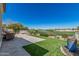 Gorgeous backyard featuring a putting green, spa, water feature and a golf course view at 36053 N Stoneware Dr, Queen Creek, AZ 85140