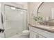 Bathroom featuring a glass-enclosed shower, white subway tile, and a modern vanity at 36053 N Stoneware Dr, Queen Creek, AZ 85140