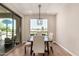 Bright dining room with modern lighting, a view, and glass slider to the outside patio at 36053 N Stoneware Dr, Queen Creek, AZ 85140
