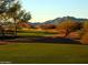 Picturesque view of the golf course with mountains in the background at 36053 N Stoneware Dr, Queen Creek, AZ 85140