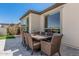 Outdoor dining area with a large table and seating for eight, perfect for entertaining at 36053 N Stoneware Dr, Queen Creek, AZ 85140