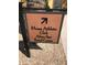 Sign for Mossa Athletic Club, Alvea Spa, and Postal Center in a community with beautiful landscaping at 36053 N Stoneware Dr, Queen Creek, AZ 85140