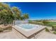 Relaxing in-ground spa overlooking the golf course at 36053 N Stoneware Dr, Queen Creek, AZ 85140