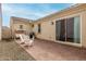 Charming backyard patio with a swing, seating, and a sliding door to the home's interior at 3842 E Bartlett Way, Chandler, AZ 85249
