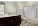 Functional bathroom featuring a combined tub and shower, vanity with sink, and clean lines at 3842 E Bartlett Way, Chandler, AZ 85249