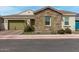 Charming single-story home featuring a two-car garage, stone accents, and well-maintained landscaping at 3842 E Bartlett Way, Chandler, AZ 85249