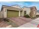 Charming home with an attached garage, brick driveway, and well-maintained landscaping at 3842 E Bartlett Way, Chandler, AZ 85249