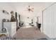 Spacious bedroom with two beds, a fan and a large closet at 3917 E Des Moines St, Mesa, AZ 85205