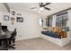 Bedroom featuring a desk, chair, and comfortable daybed with under-bed storage at 3917 E Des Moines St, Mesa, AZ 85205
