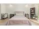 Bright bedroom with a ceiling fan, neutral tones, a comfy bed and stylish furniture at 3917 E Des Moines St, Mesa, AZ 85205