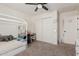 Neutral bedroom featuring a cozy bed, a desk and ceiling fan at 3917 E Des Moines St, Mesa, AZ 85205