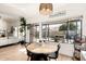 Bright dining area with a modern table setting and view of the backyard at 3917 E Des Moines St, Mesa, AZ 85205