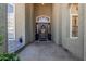 Inviting front entryway with a decorative door, sidelights, and neutral tones, creating a warm welcome at 3917 E Des Moines St, Mesa, AZ 85205