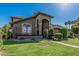 Attractive home featuring a green lawn, mature landscaping, and a welcoming entrance at 3917 E Des Moines St, Mesa, AZ 85205