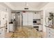 Bright kitchen featuring white cabinets, an island, and stainless steel refrigerator at 3917 E Des Moines St, Mesa, AZ 85205