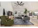 Bright living room featuring vaulted ceilings, hardwood floors, and a cozy seating area at 3917 E Des Moines St, Mesa, AZ 85205