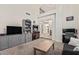 Spacious living room with grey built-ins, a coffee table, and an open floor plan at 3917 E Des Moines St, Mesa, AZ 85205