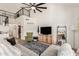 Spacious living room boasting high ceilings, a cozy chair, and modern entertainment center at 3917 E Des Moines St, Mesa, AZ 85205