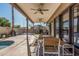 Covered patio with outdoor seating and access to a pool at 3917 E Des Moines St, Mesa, AZ 85205