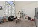 Inviting playroom featuring black sofa, shelves, and natural light at 3917 E Des Moines St, Mesa, AZ 85205