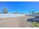 Large backyard with a block fence, offering privacy and space for outdoor activities at 4128 W Las Palmaritas Dr, Phoenix, AZ 85051
