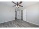 Bedroom featuring tile floors, a ceiling fan, and closet at 4128 W Las Palmaritas Dr, Phoenix, AZ 85051
