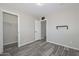 Bedroom featuring tile floors, an attached bathroom, and closet at 4128 W Las Palmaritas Dr, Phoenix, AZ 85051