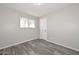 Bedroom featuring tile floors, a window with a view of a palm tree, and closet at 4128 W Las Palmaritas Dr, Phoenix, AZ 85051