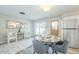 Charming dining area featuring a round table, modern chairs, and easy access to the outdoors at 4128 W Las Palmaritas Dr, Phoenix, AZ 85051
