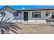 Charming single-story home featuring a white exterior, security door, and covered carport at 4128 W Las Palmaritas Dr, Phoenix, AZ 85051