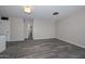 Living area features wood-style tile flooring and neutral paint throughout at 4128 W Las Palmaritas Dr, Phoenix, AZ 85051