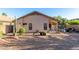 Well-maintained backyard with stone landscaping, patio furniture, and a barbecue grill for outdoor relaxation at 42568 W Bunker Dr, Maricopa, AZ 85138