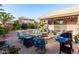 Charming backyard with outdoor seating and a grill, perfect for relaxing and entertaining guests at 42568 W Bunker Dr, Maricopa, AZ 85138