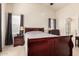The primary bedroom boasts a large window, bedside lamps, and a calm, neutral color scheme at 42568 W Bunker Dr, Maricopa, AZ 85138