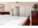 This bedroom offers a large bed, access to the ensuite bath and walk-in closet, and a soothing atmosphere at 42568 W Bunker Dr, Maricopa, AZ 85138