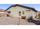 View of the backyard featuring a grill and desert landscaping at 45105 W Gavilan Dr, Maricopa, AZ 85139