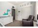 Dinosaur themed Bedroom with dino artwork, a changing table and a glider at 45105 W Gavilan Dr, Maricopa, AZ 85139