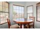 Close up of eat-in kitchen featuring wood blinds at 45105 W Gavilan Dr, Maricopa, AZ 85139