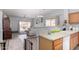 The kitchen overlooks the living area and features a breakfast bar at 45105 W Gavilan Dr, Maricopa, AZ 85139