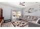 Spacious living room with sliding glass door to backyard at 45105 W Gavilan Dr, Maricopa, AZ 85139