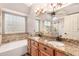 Spacious bathroom with dual sinks, granite countertops, and a glass-enclosed shower at 4779 W Tulsa St, Chandler, AZ 85226