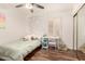 Stylish bedroom features a single bed, string lights, a mirrored closet, and a desk with natural light at 4779 W Tulsa St, Chandler, AZ 85226