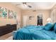 Bedroom featuring a ceiling fan, walk-in closet, and comfortable furnishings at 4779 W Tulsa St, Chandler, AZ 85226