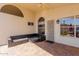 Inviting covered patio featuring an outdoor seating area, ceiling fan, and arched windows, perfect for relaxation at 4779 W Tulsa St, Chandler, AZ 85226
