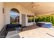 Relaxing covered patio with outdoor seating and a hot tub, ideal for enjoying the backyard ambiance at 4779 W Tulsa St, Chandler, AZ 85226