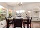 Bright dining room featuring a marble-topped table and views of the backyard at 4779 W Tulsa St, Chandler, AZ 85226